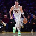 Dec 25, 2025; Los Angeles, California, USA; Los Angeles Lakers guard Luka Doncic (77) moves the ball against the Houston Rockets during the first half at Crypto.com Arena. Mandatory Credit: Gary A. Vasquez-Imagn Images