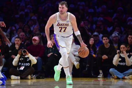 Dec 25, 2025; Los Angeles, California, USA; Los Angeles Lakers guard Luka Doncic (77) moves the ball against the Houston Rockets during the first half at Crypto.com Arena. Mandatory Credit: Gary A. Vasquez-Imagn Images