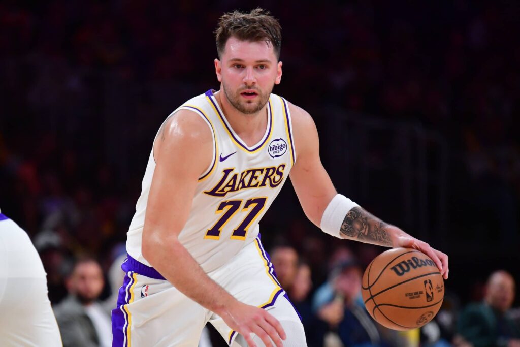 Los Angeles Lakers guard Luka Doncic (77) moves the ball against the New Orleans Pelicans during the first half at Crypto.com Arena.