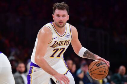 Los Angeles Lakers guard Luka Doncic (77) moves the ball against the New Orleans Pelicans during the first half at Crypto.com Arena.