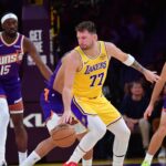 Los Angeles Lakers guard Luka Doncic (77) controls the ball against the Phoenix Suns during the first half at Crypto.com Arena.