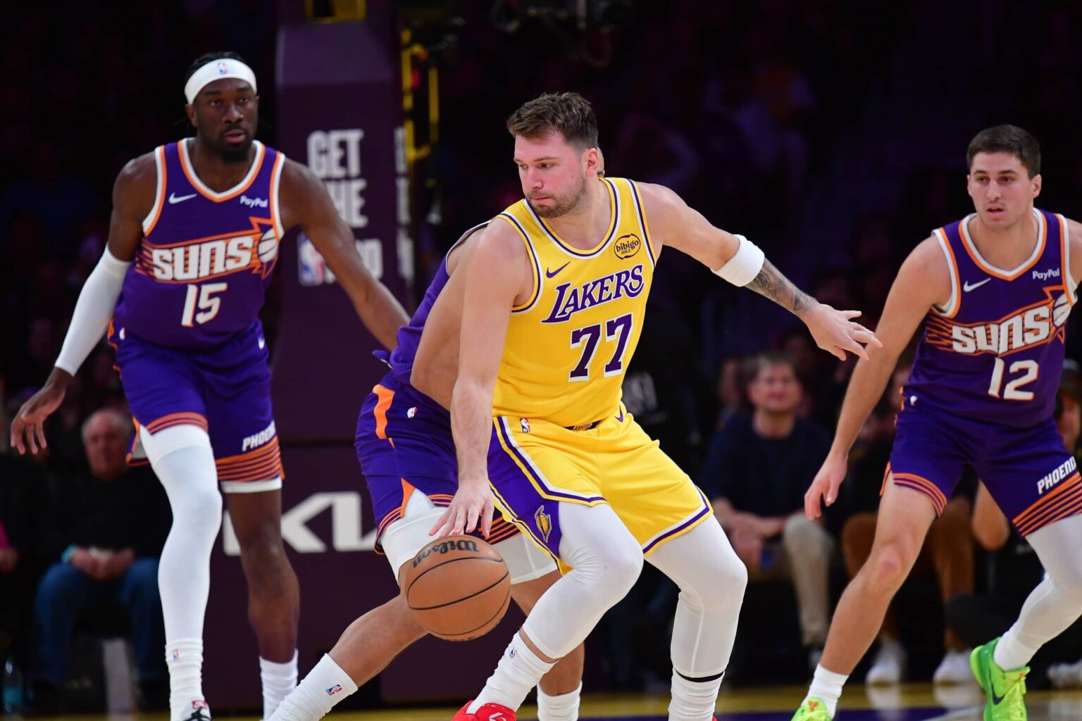 Los Angeles Lakers guard Luka Doncic (77) controls the ball against the Phoenix Suns during the first half at Crypto.com Arena.