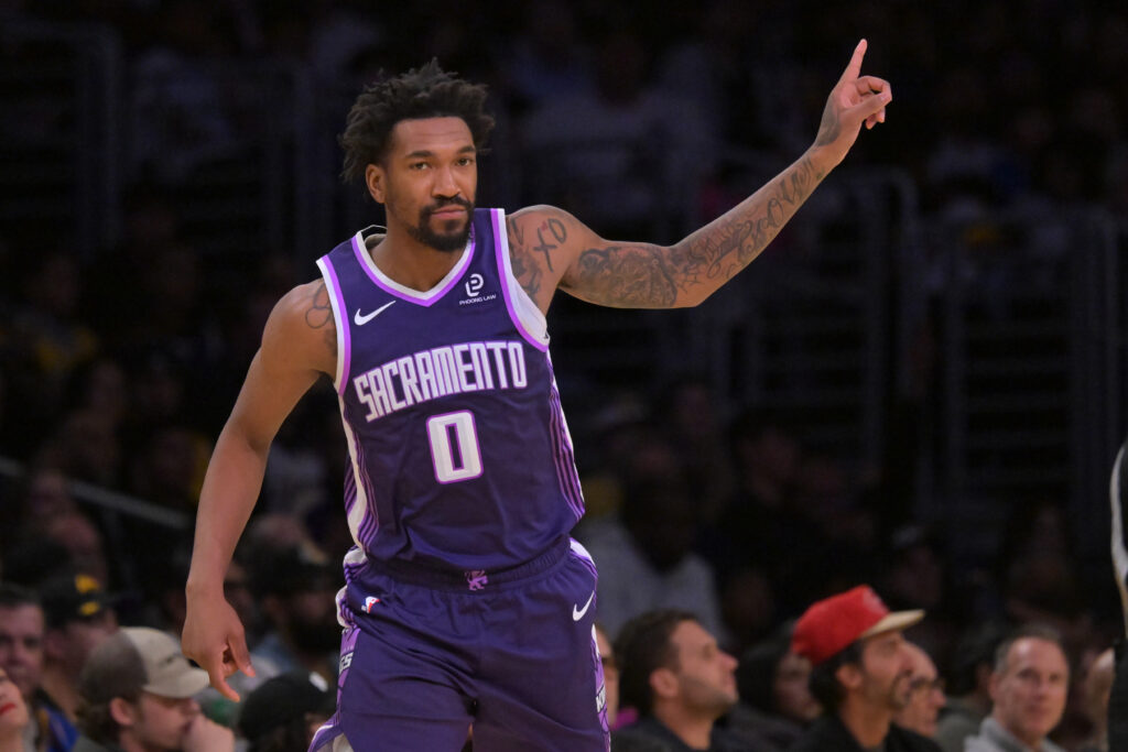 Dec 28, 2025; Los Angeles, California, USA; Sacramento Kings guard Malik Monk (0) reacts after a 3-point basket in the second half against the Los Angeles Lakers at Crypto.com Arena. Mandatory Credit: Jayne Kamin-Oncea-Imagn Images