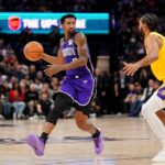 Dec 19, 2024; Sacramento, California, USA; Sacramento Kings guard Malik Monk (0) dribbles the ball next to Los Angeles Lakers guard Gabe Vincent (7) in the third quarter at the Golden 1 Center. Mandatory Credit: Cary Edmondson-Imagn Images
