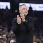 Denver Nuggets head coach Michael Malone watches his team play against the Oklahoma City Thunder during the first quarter at Paycom Center.