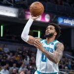 Nov 19, 2025; Indianapolis, Indiana, USA; Charlotte Hornets forward Miles Bridges (0) shoots the ball in the first half against the Indiana Pacers at Gainbridge Fieldhouse. Mandatory Credit: Trevor Ruszkowski-Imagn Images