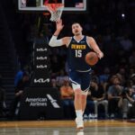 Dec 29, 2025; Miami, Florida, USA; Denver Nuggets center Nikola Jokic (15) dribbles the basketball against the Miami Heat during the first quarter at Kaseya Center. Mandatory Credit: Sam Navarro-Imagn Images