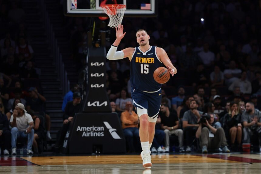 Dec 29, 2025; Miami, Florida, USA; Denver Nuggets center Nikola Jokic (15) dribbles the basketball against the Miami Heat during the first quarter at Kaseya Center. Mandatory Credit: Sam Navarro-Imagn Images