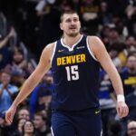 Denver Nuggets center Nikola Jokic (15) reacts after a three point basket in the fourth quarter against the Houston Rockets at Ball Arena.