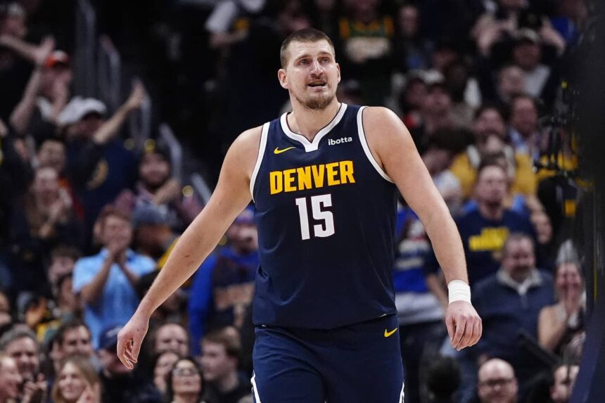 Denver Nuggets center Nikola Jokic (15) reacts after a three point basket in the fourth quarter against the Houston Rockets at Ball Arena.