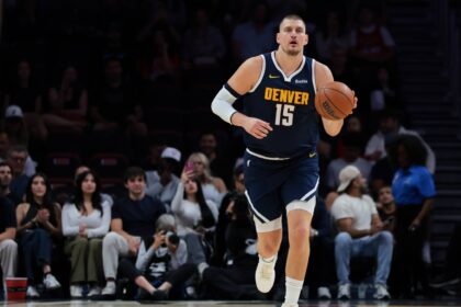 Denver Nuggets center Nikola Jokic (15) dribbles the basketball against the Miami Heat during the first quarter at Kaseya Center.