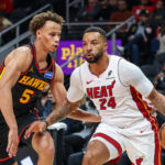 Dec 26, 2025; Atlanta, Georgia, USA; Miami Heat guard Norman Powell (24) dribbles the ball towards the goal against Atlanta Hawks guard Dyson Daniels (5) during the first quarter at State Farm Arena. Mandatory Credit: Jordan Godfree-Imagn Images