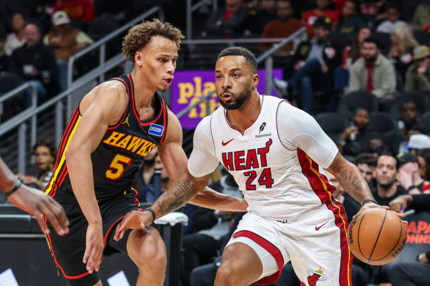 Dec 26, 2025; Atlanta, Georgia, USA; Miami Heat guard Norman Powell (24) dribbles the ball towards the goal against Atlanta Hawks guard Dyson Daniels (5) during the first quarter at State Farm Arena. Mandatory Credit: Jordan Godfree-Imagn Images