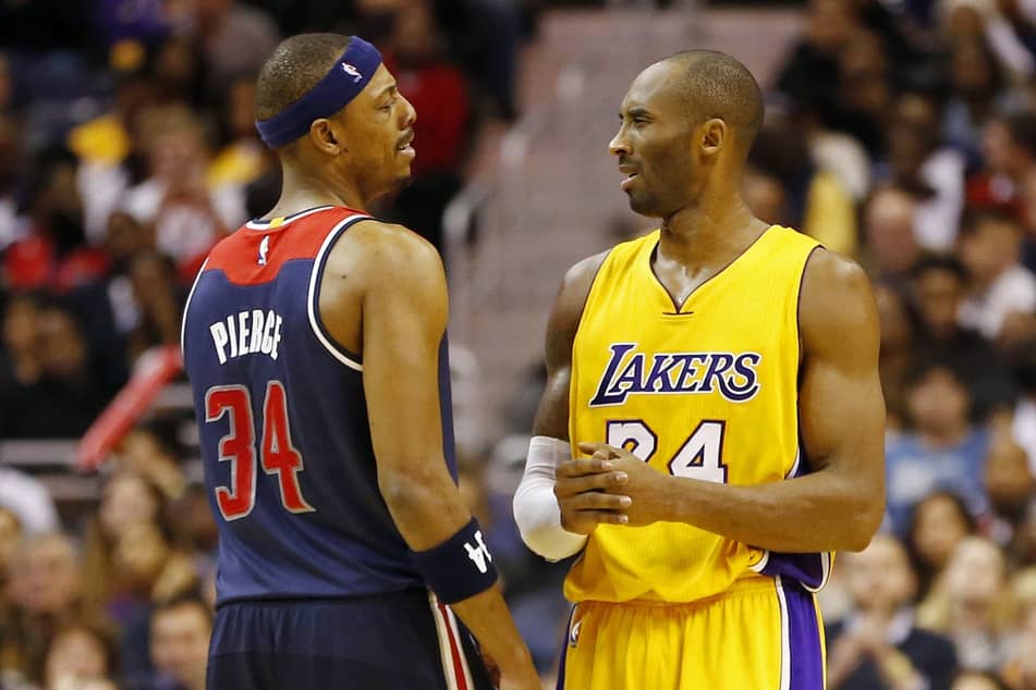 Washington Wizards forward Paul Pierce (34) talks to Los Angeles Lakers guard Kobe Bryant (24) at Verizon Center.