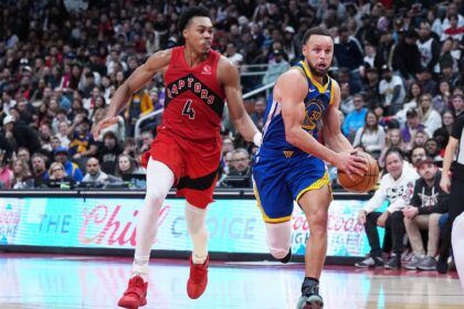 Dec 28, 2025; Toronto, Ontario, CAN; Golden State Warriors guard Stephen Curry (30) controls the ball as Toronto Raptors forward Scottie Barnes (4) tries to defend during the overtime at Scotiabank Arena. Mandatory Credit: Nick Turchiaro-Imagn Images