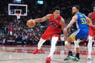Dec 28, 2025; Toronto, Ontario, CAN; Toronto Raptors forward Scottie Barnes (4) controls the ball as Golden State Warriors guard Stephen Curry (30) tries to defend during the second quarter at Scotiabank Arena. Mandatory Credit: Nick Turchiaro-Imagn Images