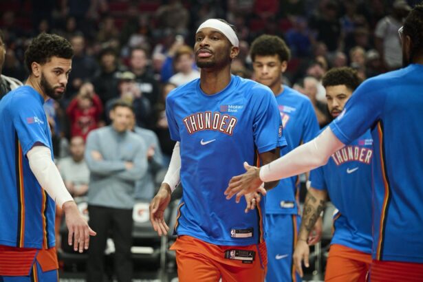Nov 30, 2025; Portland, Oregon, USA; Oklahoma City Thunder guard Shai Gilgeous-Alexander (2) greets teammates during introductions before a game against the Portland Trail Blazers at Moda Center. Mandatory Credit: Troy Wayrynen-Imagn Images