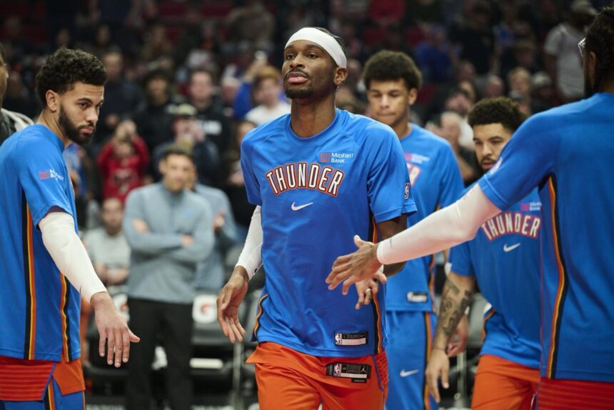 Nov 30, 2025; Portland, Oregon, USA; Oklahoma City Thunder guard Shai Gilgeous-Alexander (2) greets teammates during introductions before a game against the Portland Trail Blazers at Moda Center. Mandatory Credit: Troy Wayrynen-Imagn Images