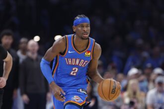 Dec 22, 2025; Oklahoma City, Oklahoma, USA; Oklahoma City Thunder guard Shai Gilgeous-Alexander (2) dribbles down the court against the Memphis Grizzlies during the second half at Paycom Center. Mandatory Credit: Alonzo Adams-Imagn Images