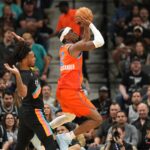 Dec 23, 2025; San Antonio, Texas, USA; Oklahoma City Thunder guard Shai Gilgeous-Alexander (2) shoots ahead of San Antonio Spurs guard Stephon Castle (5) during the first half at Frost Bank Center. Mandatory Credit: Scott Wachter-Imagn Images