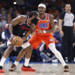 Nov 11, 2024; Oklahoma City, Oklahoma, USA; Oklahoma City Thunder guard Shai Gilgeous-Alexander (2) defends a drive by Los Angeles Clippers guard James Harden (1) during the second quarter at Paycom Center. Mandatory Credit: Alonzo Adams-Imagn Images