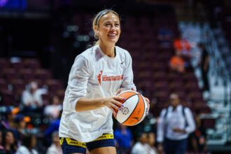 Indiana Fever guard Sophie Cunningham (8) warms up before the start of the game against the Connecticut Sun at Mohegan Sun Arena.
