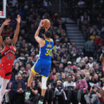 Dec 28, 2025; Toronto, Ontario, CAN; Golden State Warriors guard Stephen Curry (30) shoots the ball as Toronto Raptors guard Ochai Agbaji (30) tries to defend during the first quarter at Scotiabank Arena. Mandatory Credit: Nick Turchiaro-Imagn Images
