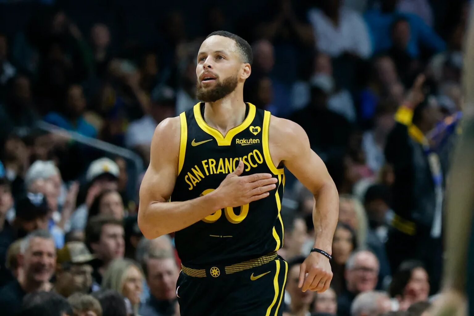 Mar 29, 2024; Charlotte, North Carolina, USA; Golden State Warriors guard Stephen Curry (30) pats his chest after making a three-point basket against the Charlotte Hornets during the first quarter at Spectrum Center. Mandatory Credit: Nell Redmond-Imagn Images
