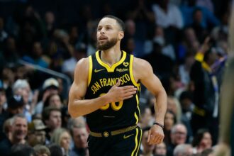 Mar 29, 2024; Charlotte, North Carolina, USA; Golden State Warriors guard Stephen Curry (30) pats his chest after making a three-point basket against the Charlotte Hornets during the first quarter at Spectrum Center. Mandatory Credit: Nell Redmond-Imagn Images