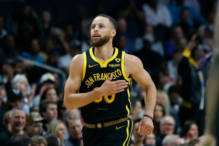 Mar 29, 2024; Charlotte, North Carolina, USA; Golden State Warriors guard Stephen Curry (30) pats his chest after making a three-point basket against the Charlotte Hornets during the first quarter at Spectrum Center. Mandatory Credit: Nell Redmond-Imagn Images