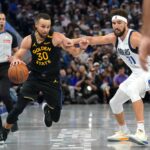 Golden State Warriors guard Stephen Curry (30) dribbles past Dallas Mavericks guard Klay Thompson (31) in the fourth quarter at the Chase Center.