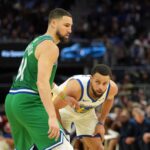 Dec 25, 2025; San Francisco, California, USA; Dallas Mavericks guard Klay Thompson (left) defends against Golden State Warriors guard Stephen Curry (right) during the fourth quarter at Chase Center. Mandatory Credit: Darren Yamashita-Imagn Images