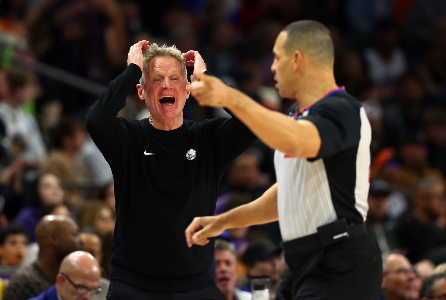 Dec 18, 2025; Phoenix, Arizona, USA; Golden State Warriors head coach Steve Kerr reacts against the Phoenix Suns in the second half at Mortgage Matchup Center. Mandatory Credit: Mark J. Rebilas-Imagn Images, top