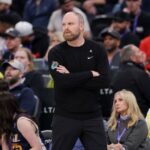 Memphis Grizzlies head coach Taylor Jenkins watches his team from the sidelines during the first quarter against the Utah Jazz at Delta Center.
