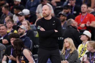 Memphis Grizzlies head coach Taylor Jenkins watches his team from the sidelines during the first quarter against the Utah Jazz at Delta Center.