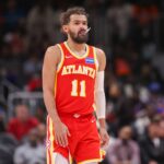 Dec 27, 2025; Atlanta, Georgia, USA; Atlanta Hawks guard Trae Young (11) in action against the New York Knicks in the fourth quarter at State Farm Arena. Mandatory Credit: Brett Davis-Imagn Images