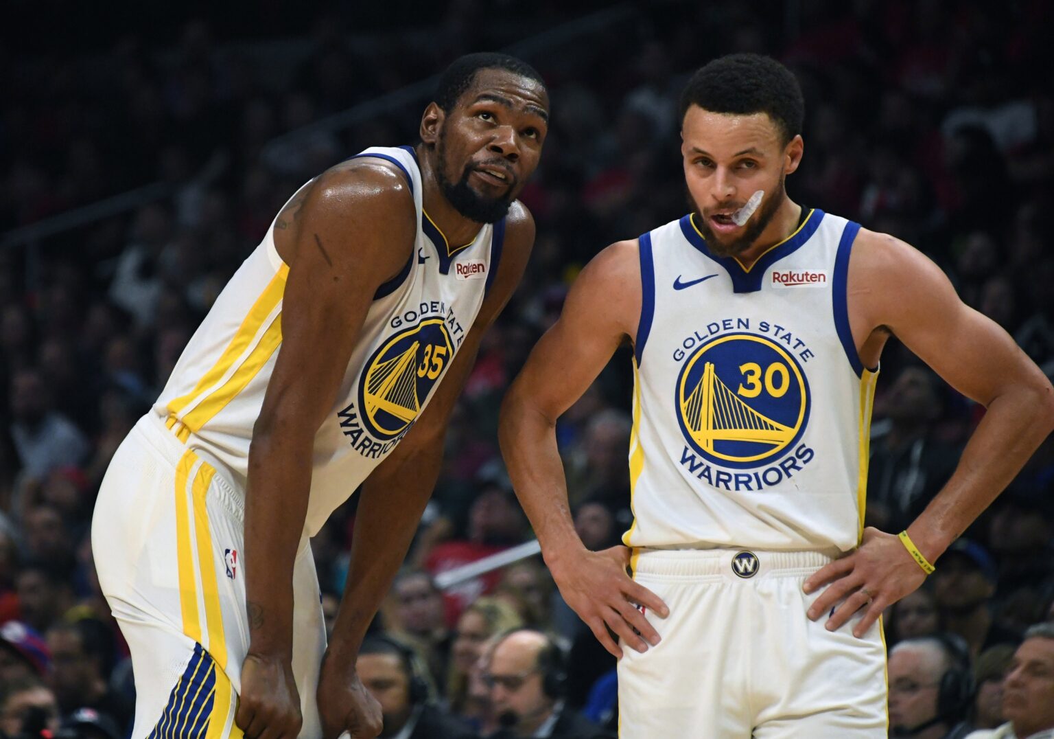 Apr 26, 2019; Los Angeles, CA, USA; Golden State Warriors guard Stephen Curry (30) and forward Kevin Durant (35) react in the first half of game six of the first round of the 2019 NBA Playoffs against the LA Clippers at Staples Center. Mandatory Credit: Kirby Lee-USA TODAY Sports