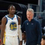 October 20, 2023; San Francisco, California, USA; Golden State Warriors head coach Steve Kerr (right) talks to forward Jonathan Kuminga (00) during the third quarter against the San Antonio Spurs at Chase Center. Mandatory Credit: Kyle Terada-Imagn Images