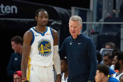 October 20, 2023; San Francisco, California, USA; Golden State Warriors head coach Steve Kerr (right) talks to forward Jonathan Kuminga (00) during the third quarter against the San Antonio Spurs at Chase Center. Mandatory Credit: Kyle Terada-Imagn Images