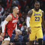 Jan 29, 2024; Houston, Texas, USA; Houston Rockets forward Dillon Brooks (9) reacts toward Los Angeles Lakers forward LeBron James (23) after scoring a basket during the fourth quarter at Toyota Center. Mandatory Credit: Troy Taormina-USA TODAY Sports