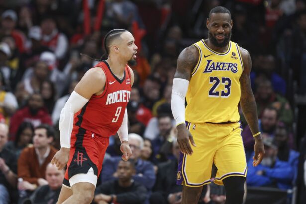 Jan 29, 2024; Houston, Texas, USA; Houston Rockets forward Dillon Brooks (9) reacts toward Los Angeles Lakers forward LeBron James (23) after scoring a basket during the fourth quarter at Toyota Center. Mandatory Credit: Troy Taormina-USA TODAY Sports