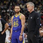 Feb 15, 2024; Salt Lake City, Utah, USA; Golden State Warriors guard Stephen Curry (30) and head coach Steve Kerr talk on the sideline during the first quarter against the Utah Jazz at Delta Center. Mandatory Credit: Chris Nicoll-Imagn Images