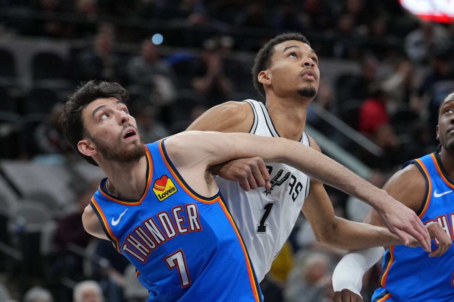 Feb 29, 2024; San Antonio, Texas, USA; Oklahoma City Thunder forward Chet Holmgren (7) and San Antonio Spurs center Victor Wembanyama (1) battle for position in the first half at Frost Bank Center. Mandatory Credit: Daniel Dunn-USA TODAY Sports