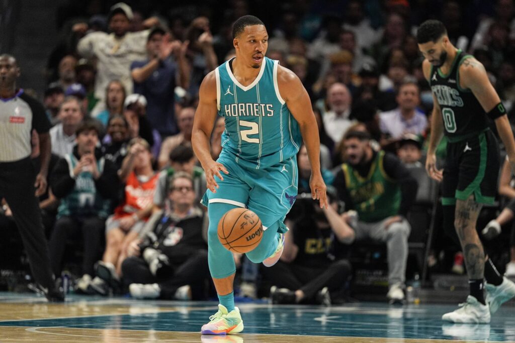 Nov 1, 2024; Charlotte, North Carolina, USA; Charlotte Hornets forward Grant Williams (2) brings the ball up court against the Boston Celtics during the second half at the Spectrum Center. Mandatory Credit: Jim Dedmon-Imagn Images
