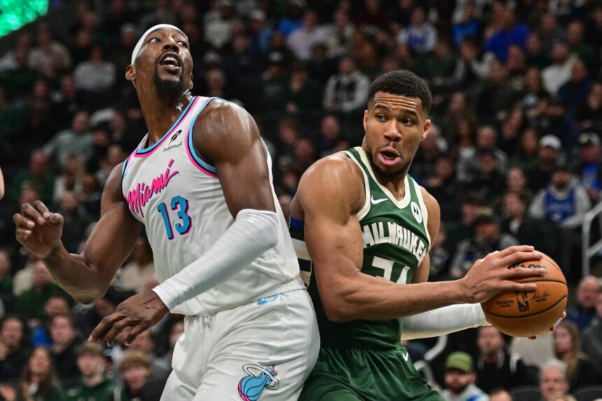 Jan 23, 2025; Milwaukee, Wisconsin, USA; Milwaukee Bucks forward Giannis Antetokounmpo (34) looks for a shot against Miami Heat center Bam Adebayo (13) in the second quarter at Fiserv Forum. Mandatory Credit: Benny Sieu-Imagn Images