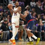 Jan 27, 2025; Phoenix, Arizona, USA; LA Clippers guard James Harden (1) guards Phoenix Suns forward Kevin Durant (35) during the second half at Footprint Center. Mandatory Credit: Joe Camporeale-Imagn Images