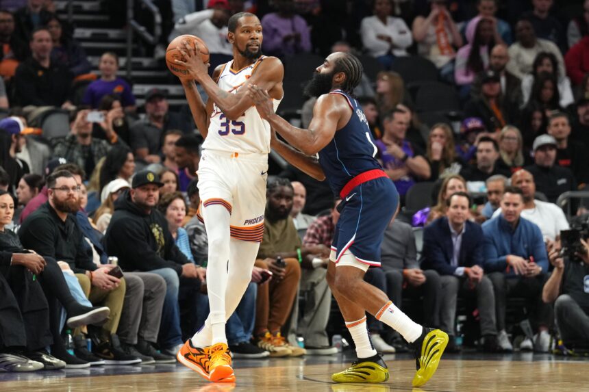 Jan 27, 2025; Phoenix, Arizona, USA; LA Clippers guard James Harden (1) guards Phoenix Suns forward Kevin Durant (35) during the second half at Footprint Center. Mandatory Credit: Joe Camporeale-Imagn Images