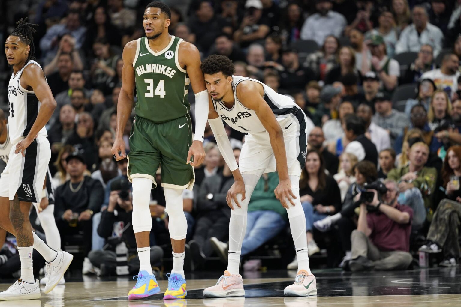 Jan 31, 2025; San Antonio, Texas, USA; Milwaukee Bucks forward Giannis Antetokounmpo (34) and San Antonio Spurs center Victor Wembanyama (1) during the first half at Frost Bank Center. Mandatory Credit: Scott Wachter-Imagn Images