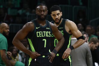 Feb 28, 2025; Boston, Massachusetts, USA; Boston Celtics guard Jaylen Brown (7) and forward Jayson Tatum (0) stand on the court during a timeout during the second half of their loss to the Cleveland Cavaliers at TD Garden. Mandatory Credit: Winslow Townson-Imagn Images