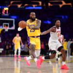 Mar 6, 2025; Los Angeles, California, USA; Los Angeles Lakers forward LeBron James (23) passes the ball ahead of New York Knicks forward OG Anunoby (8) during the second half at Crypto.com Arena. Mandatory Credit: Gary A. Vasquez-Imagn Images